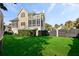 Large backyard with lush grass and a view of the house at 217 Old Hickory Xing, Johns Island, SC 29455