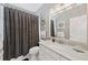 Clean bathroom with a white vanity, marble countertop and shower/tub combo at 217 Old Hickory Xing, Johns Island, SC 29455