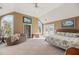 Spacious bedroom with a king-size bed, a beanbag chair, and large windows at 217 Old Hickory Xing, Johns Island, SC 29455