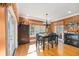 Bright dining room features hardwood floors, a table with chairs, and access to the outdoors at 217 Old Hickory Xing, Johns Island, SC 29455
