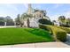Bright yellow house with palm trees and manicured lawn at 217 Old Hickory Xing, Johns Island, SC 29455