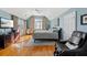 Large main bedroom with hardwood floors, a king-size bed and plenty of natural light at 217 Old Hickory Xing, Johns Island, SC 29455