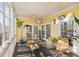 Spacious screened porch with glass doors and a TV provides additional living space at 217 Old Hickory Xing, Johns Island, SC 29455