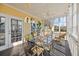 Enjoy this screened porch with glass-top table and chairs, perfect for outdoor dining at 217 Old Hickory Xing, Johns Island, SC 29455