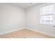 Simple bedroom with light gray walls, vinyl plank flooring, and white doors at 217 Terrace View Dr, Summerville, SC 29486