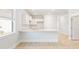Open concept kitchen with island and white cabinets at 217 Terrace View Dr, Summerville, SC 29486