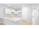 Modern kitchen with white cabinets and quartz countertops at 217 Terrace View Dr, Summerville, SC 29486