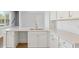 Modern kitchen with white cabinets, quartz countertops and island at 219 Terrace View Dr, Summerville, SC 29486