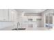 Bright kitchen with white cabinets, quartz countertops, and stainless steel sink at 219 Terrace View Dr, Summerville, SC 29486