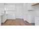 Spacious kitchen with white cabinets and hardwood floors at 219 Terrace View Dr, Summerville, SC 29486