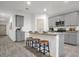 Modern kitchen with gray cabinets, granite countertops, and island at 221 Terrace View Dr, Summerville, SC 29486
