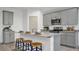 Open kitchen with gray cabinets and granite island at 221 Terrace View Dr, Summerville, SC 29486