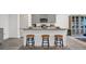 Kitchen island with granite top and three blue and gold stools at 221 Terrace View Dr, Summerville, SC 29486