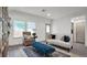 Bright living room with off-white sofa and blue accents at 221 Terrace View Dr, Summerville, SC 29486
