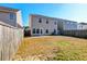 Spacious backyard with a patio and wooden fence at 234 Swamp Creek Ln, Moncks Corner, SC 29461