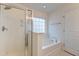 Bright bathroom with a shower/tub combo and a window at 234 Swamp Creek Ln, Moncks Corner, SC 29461