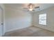 Simple bedroom with window, ceiling fan, and neutral carpeting at 234 Swamp Creek Ln, Moncks Corner, SC 29461