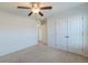 Bedroom with double doors leading to a hallway and neutral carpeting at 234 Swamp Creek Ln, Moncks Corner, SC 29461