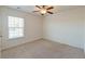 Well-lit bedroom featuring a window with blinds and neutral carpeting at 234 Swamp Creek Ln, Moncks Corner, SC 29461