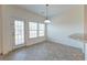 Simple dining room with tiled flooring and access to backyard at 234 Swamp Creek Ln, Moncks Corner, SC 29461