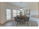 Dining area with wood table, gray chairs, and access to the backyard at 234 Swamp Creek Ln, Moncks Corner, SC 29461