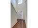 Bright entryway with hardwood floors, white door, and a high ceiling at 234 Swamp Creek Ln, Moncks Corner, SC 29461