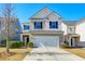 Two-story house with attached garage, landscaping, and neutral colors at 234 Swamp Creek Ln, Moncks Corner, SC 29461