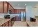 Kitchen with dark wood cabinets, granite countertops, and stainless steel appliances at 234 Swamp Creek Ln, Moncks Corner, SC 29461