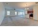Spacious living room with hardwood floors and access to the kitchen at 234 Swamp Creek Ln, Moncks Corner, SC 29461