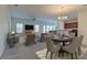Open living and dining area with neutral colors and staged furniture at 234 Swamp Creek Ln, Moncks Corner, SC 29461