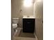 Small bathroom with dark vanity and tile floor at 292 Fleming Rd # C, Charleston, SC 29412