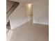 Living room with tile floors and staircase at 292 Fleming Rd # C, Charleston, SC 29412