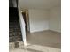 Spacious living room with tile floors and a staircase at 292 Fleming Rd # C, Charleston, SC 29412