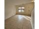 Living room with tile floors and front door view at 292 Fleming Rd # C, Charleston, SC 29412