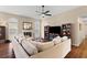 Living room with sectional sofa, fireplace, built-in shelving, and hardwood floors at 302 Damascus Dr, Summerville, SC 29483