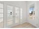 View of the home's exterior from the entryway, showing natural light at 349 Trailmore Ln, Summerville, SC 29486