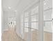 Bright and airy entryway with hardwood floors and French doors leading to an office at 349 Trailmore Ln, Summerville, SC 29486