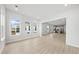 Open living space with hardwood floors and large windows offering natural light at 349 Trailmore Ln, Summerville, SC 29486