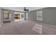 Living room with carpet, ceiling fan, and views of the kitchen at 3529 Galaxy Rd, Ladson, SC 29456