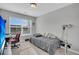 Bright bedroom with a daybed, window, and workspace at 396 Painted Lady Ln, Goose Creek, SC 29445