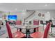 Dining area with red chairs and a glass-top table at 396 Painted Lady Ln, Goose Creek, SC 29445