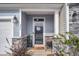 Inviting front porch with stone accents at 396 Painted Lady Ln, Goose Creek, SC 29445