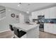 Modern kitchen with white cabinets, quartz countertops, and an island at 396 Painted Lady Ln, Goose Creek, SC 29445