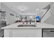 Modern kitchen island with white cabinets and a stainless steel sink at 396 Painted Lady Ln, Goose Creek, SC 29445
