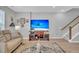 Spacious living room featuring hardwood floors and a large TV at 396 Painted Lady Ln, Goose Creek, SC 29445