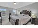 Comfortable main bedroom with a king-size bed and large windows at 396 Painted Lady Ln, Goose Creek, SC 29445