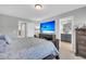 Main bedroom with ensuite bathroom and large TV at 396 Painted Lady Ln, Goose Creek, SC 29445