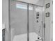 Large walk-in shower with marble tile and built-in seat at 396 Painted Lady Ln, Goose Creek, SC 29445