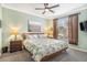 Main bedroom with ceiling fan and ensuite bathroom access at 45 Sycamore Ave # 523, Charleston, SC 29407