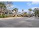 Attractive community entrance with landscaping and palm trees at 45 Sycamore Ave # 523, Charleston, SC 29407